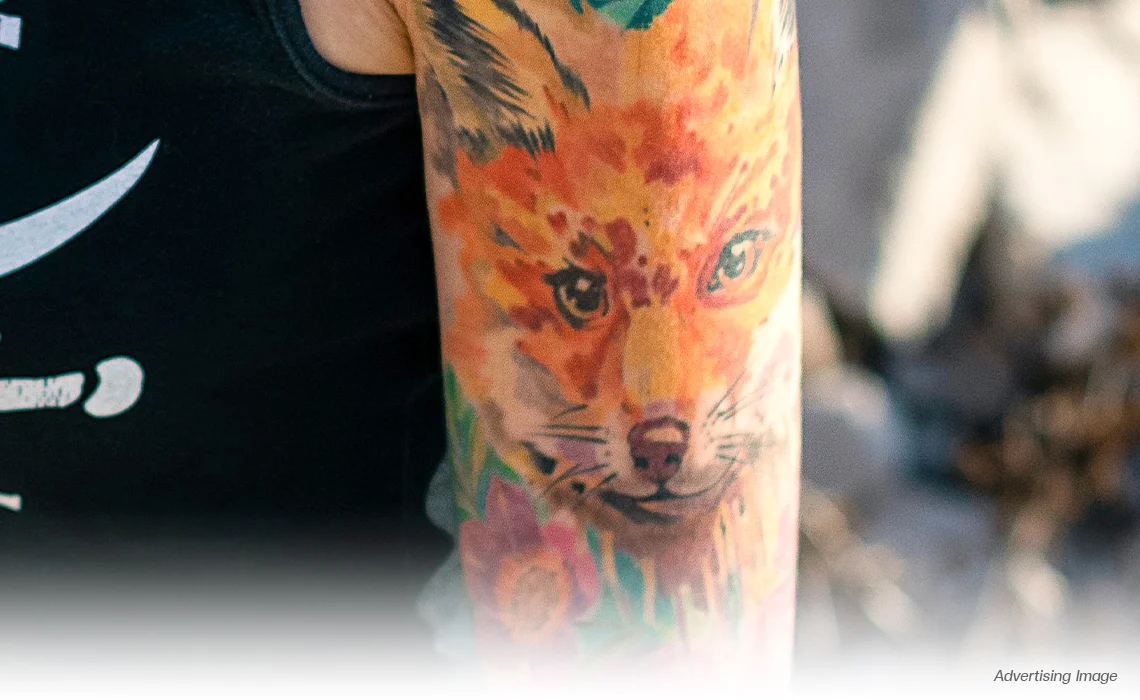colorful fox arm tattoo with red orange yellow green inks for pico laser tattoo removal in bangkok thailand multi colour tattoo removal pico laser tattoo removal thailand tattoo removal clinic bangkok pico tattoo removal near me